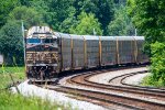 A southbound autorack train rounds the bend at Oneida   